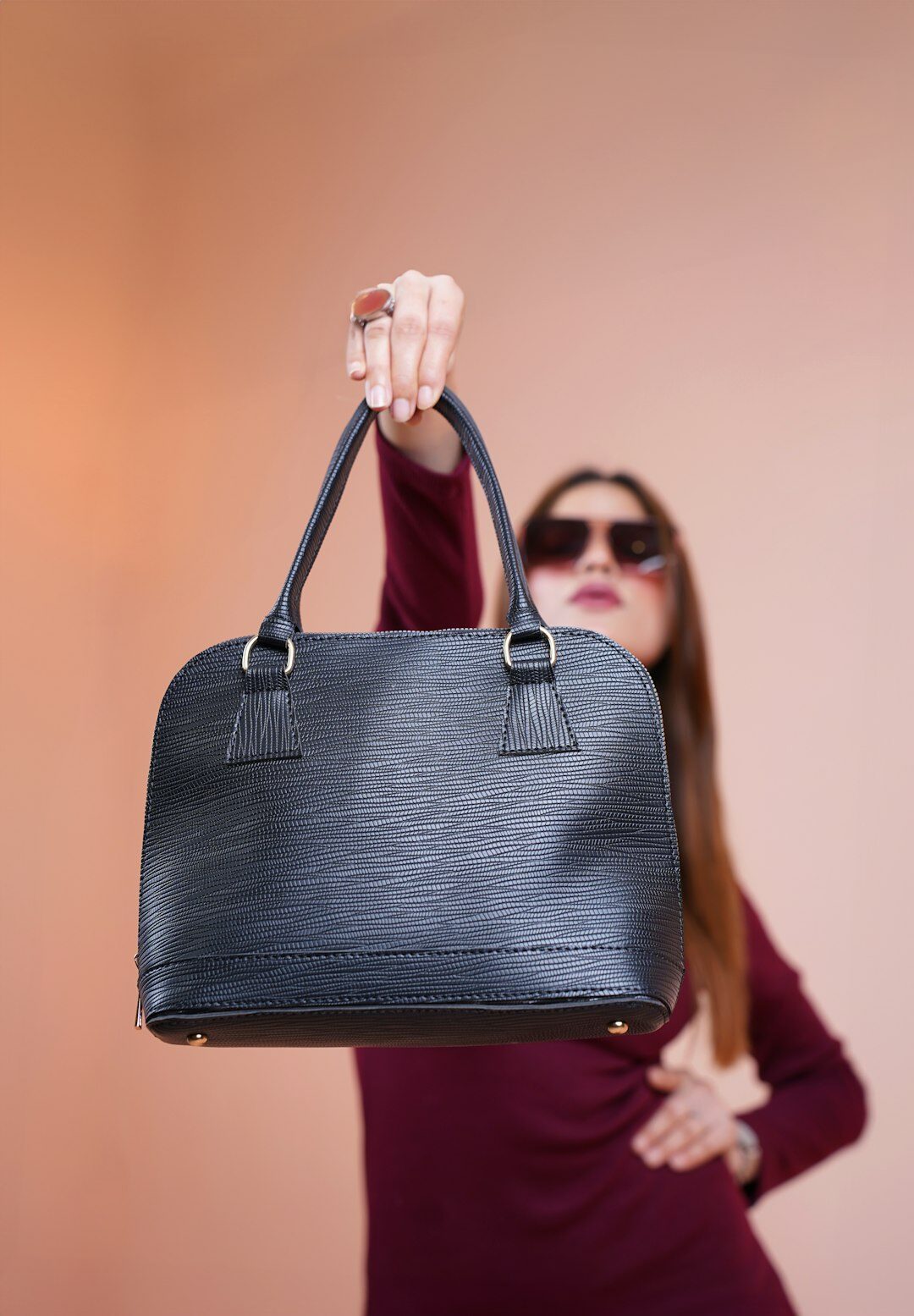 elegant woman carrying luxury handbag