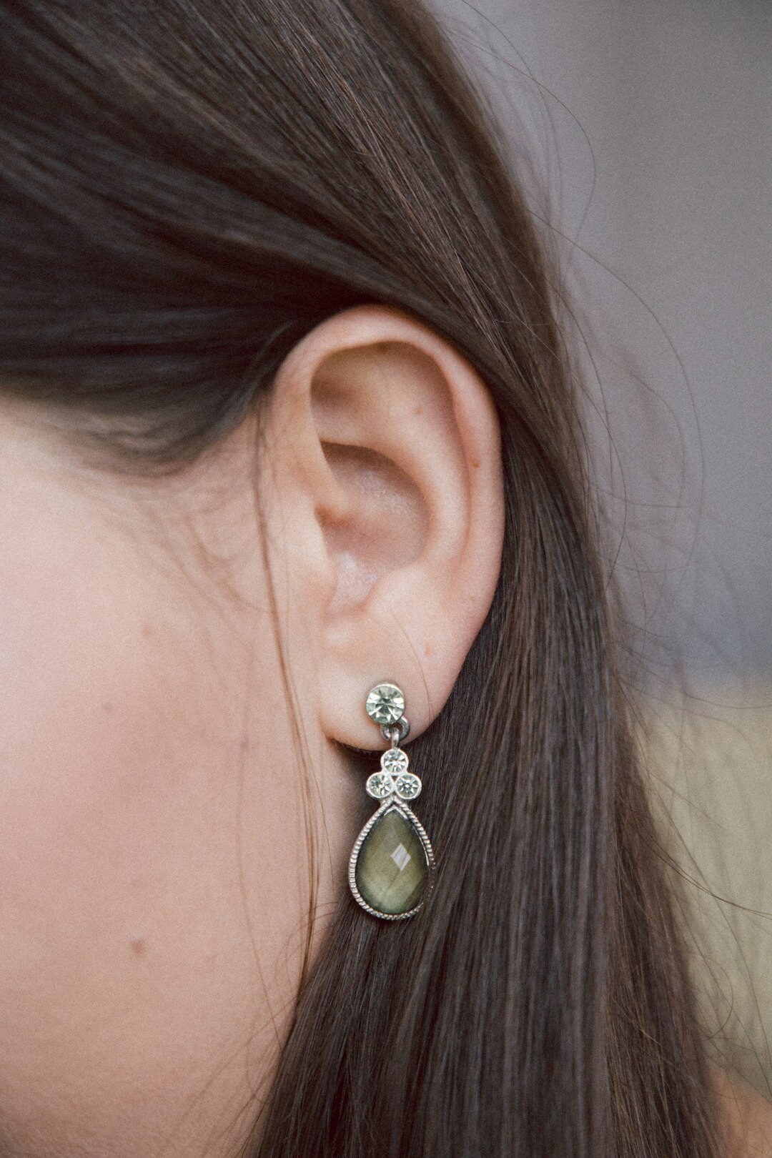 woman wearing artisan earrings