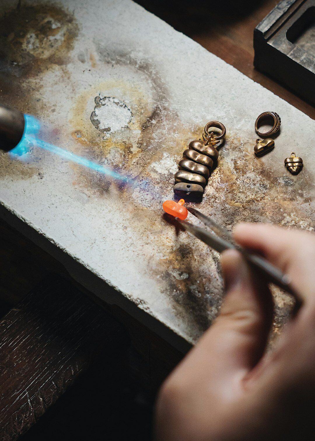 artisan crafting gold jewelry